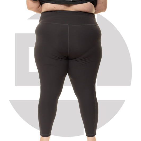 Back view of grey high waist plus size leggings from Gym Stuff Plus showing supportive waistband and side pockets.