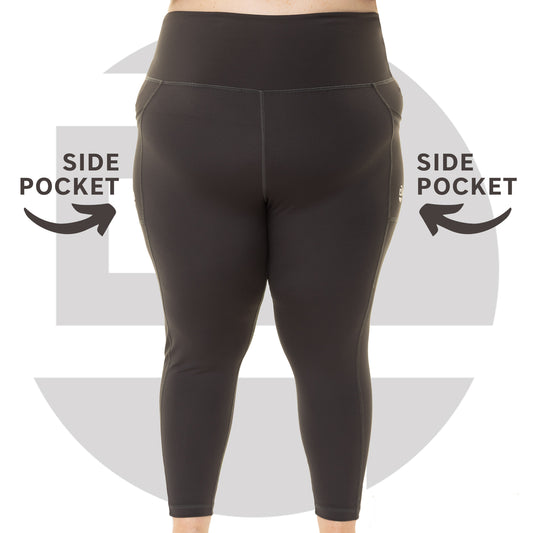 Plus size woman wearing grey high waist squat proof leggings from Gym Stuff Plus, supportive fit with pockets.