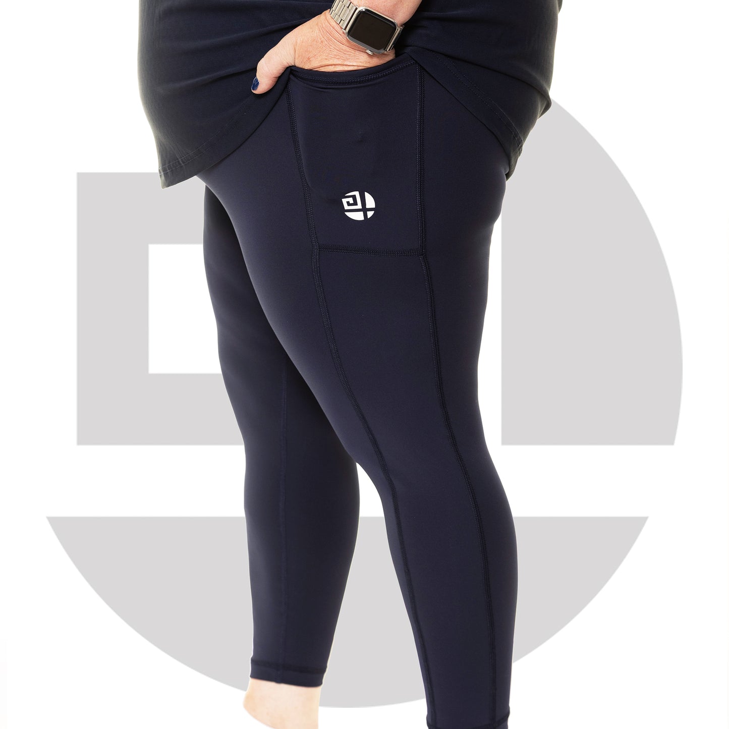 Side view of navy plus size high waist leggings from Gym Stuff Plus showing pocket detail and flattering fit.
