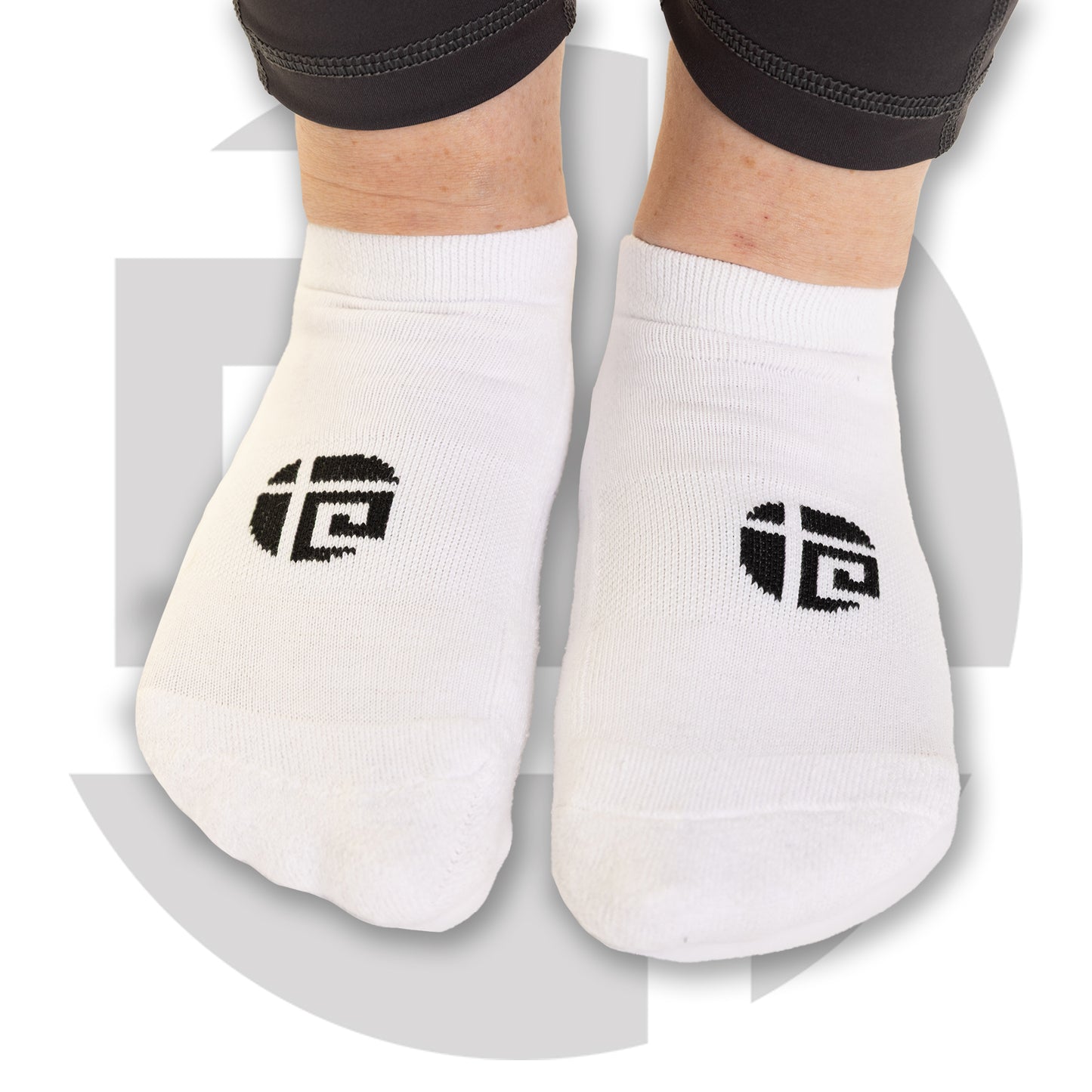 White everyday sport socks from Gym Stuff Plus worn by plus size woman, soft stretch fit for gym workouts.