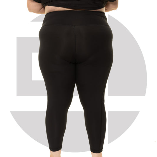 Back view of black high waist plus size leggings from Gym Stuff Plus showing supportive waistband and side pockets.